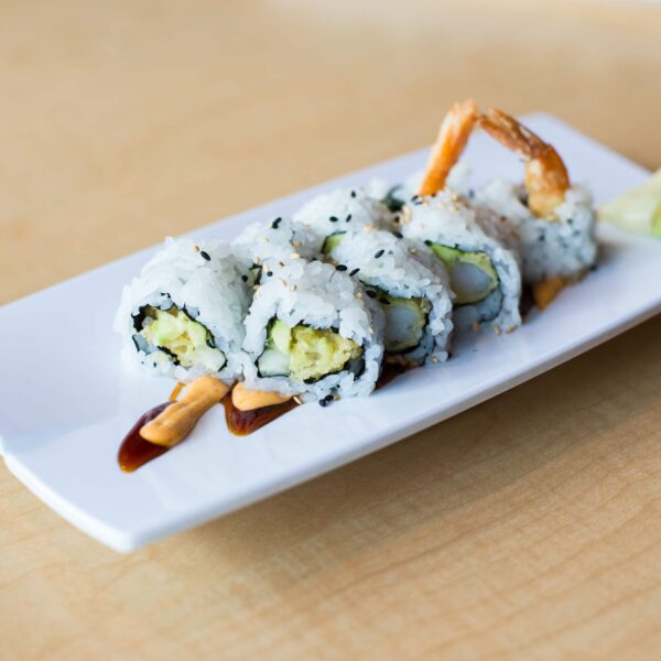 Dragon Roll Tray: Eel, avocado, and cucumber elegantly draped over a shrimp tempura roll. (For 10 People)