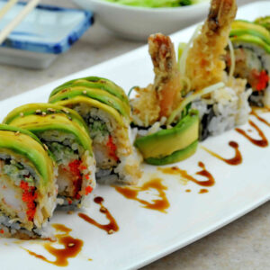 Dragon Roll Tray: Eel, avocado, and cucumber elegantly draped over a shrimp tempura roll. (For 5 People)