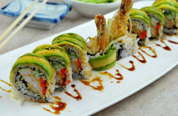 Dragon Roll Tray: Eel, avocado, and cucumber elegantly draped over a shrimp tempura roll. (For 5 People)