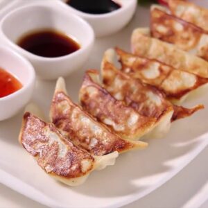 Pork Gyoza Tray with Dipping Sauce (Feeds X)