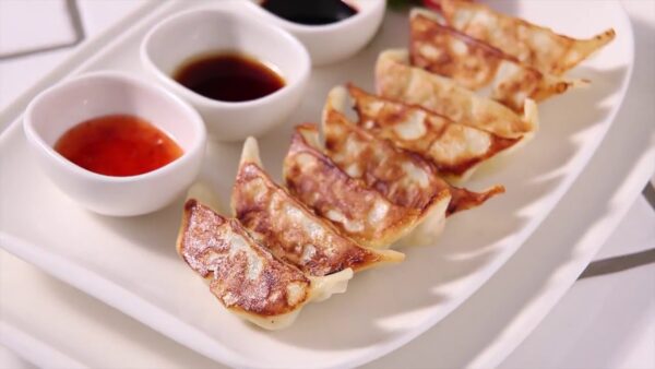 Pork Gyoza Tray with Dipping Sauce (Feeds X)